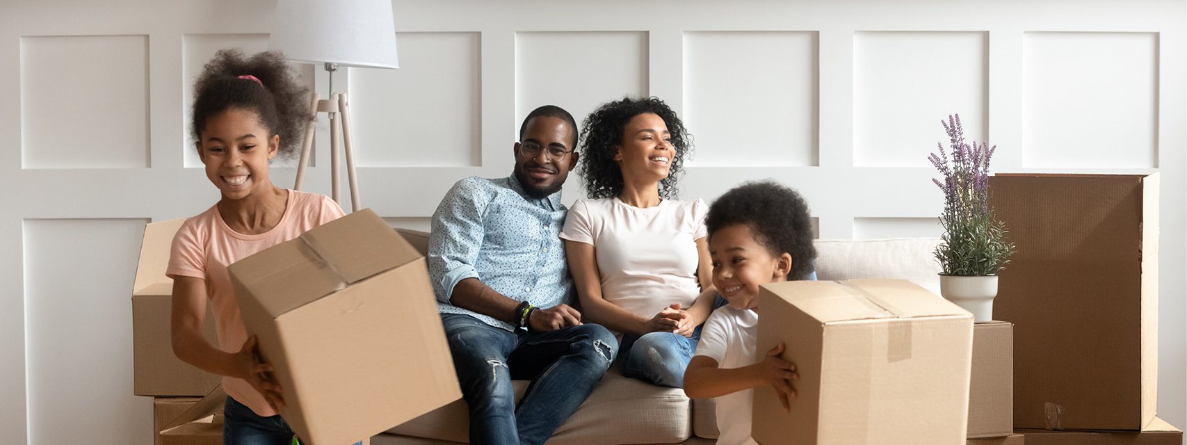 Convergence banner - Photo of young family moving into their home